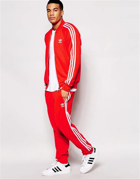 red adidas tracksuit set.